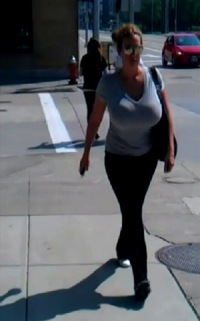 Busty Beauty in a Blue Top Walking on Street Candid Shot.png