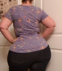 Brunette Busty Big Hourglass Massively Big Beautiful Butt Hips and Thighs in a Purple Top and ...png