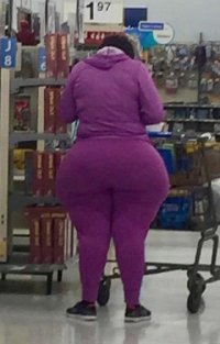 Black Lady with Huge Massive Ass in a Purple Sweat Suit at a Store Candid from Behind Shot.jpg