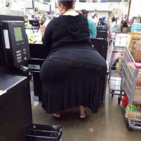 Lady with a Monster Booty in a Long Black Dress Shopping at Walmart in a Closeup from Behind S...jpg